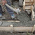 Construction worker making concrete foundation in formwork stock photo © simazoran