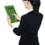 Rear view of corporate woman using green calculator stock photo © stockyimages