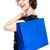 Joyous woman posing with a shopping bag stock photo © stockyimages