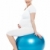 Pregnant lady sitting on exercise ball stock photo © stockyimages