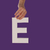 Female hand holding up the letter E from top stock photo © stryjek
