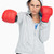 Brunette in sweatshirt boxing with red gloves against white background stock photo © wavebreak_media