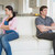 Two people sitting on the couch with crossing arms and falling quiet in the living room stock photo © wavebreak_media