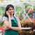 Florist doing a phone call while smiling and standing in the garden center stock photo © wavebreak_media