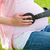 Pregnant woman putting her earphone on her belly stock photo © wavebreak_media