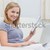 Woman using her laptop and looking happy on sofa in the living room stock photo © wavebreak_media