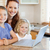 Mother together with children on the laptop in the kitchen stock photo © wavebreak_media