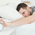 Handsome man being awakened by an alarm clock in his bedroom stock photo © wavebreak_media
