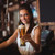 Female bar tender holding glass of beer stock photo © wavebreak_media