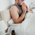 Portrait of a sick man blowing his nose in his bedroom stock photo © wavebreak_media