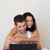 Happy couple using a laptop sitting on a bed stock photo © wavebreak_media