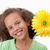 Cute girl holding a flower against a white background stock photo © wavebreak_media