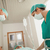 Surgeons looking at a patient in hospital hallway stock photo © wavebreak_media