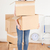 Good looking red-haired woman holding some carboard boxes at home stock photo © wavebreak_media