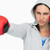 Stern woman in sweatshirt boxing against white background stock photo © wavebreak_media