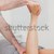 Physiotherapist bending the leg of a patient in a room stock photo © wavebreak_media