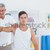 Doctor stretching a young man arm stock photo © wavebreak_media