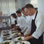 Team of chefs garnishing meal on counter stock photo © wavebreak_media