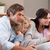 Playful family playing video games together in a living room stock photo © wavebreak_media