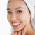 Woman wearing a towel for her hair while smiling stock photo © wavebreak_media