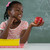 Schoolgirl holding a red apple against white background stock photo © wavebreak_media