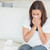 Sick woman sneezing on sofa stock photo © wavebreak_media
