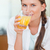 Portrait of a beautiful woman drinking juice in her kithen stock photo © wavebreak_media