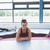Woman stretching on a mat in gym stock photo © wavebreak_media