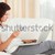 Delighted woman shopping online in her living room stock photo © wavebreak_media