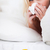 Sad blonde woman sneezing in her bed stock photo © wavebreak_media