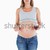 Beautiful pregnant woman holding a glass of red wine while standing against a white background stock photo © wavebreak_media