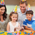Young girl about to blow out the candles on her birthday cake stock photo © wavebreak_media