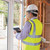 Man planning construction with the tablet pc while standing in the house stock photo © wavebreak_media