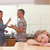 Sad little girl listening her parents having an argument in a kitchen stock photo © wavebreak_media