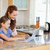Mother and daughter together with laptop in the kitchen stock photo © wavebreak_media