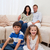 Cheerful family sitting in the living room stock photo © wavebreak_media