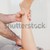 Close-up of a physiotherapist touching a knee in a room stock photo © wavebreak_media