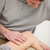 Physiotherapist looking at the knee of his patient indoors stock photo © wavebreak_media