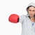 Brunette in grey sweatshirt boxing against white background stock photo © wavebreak_media