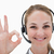 Smiling call center agent approving against a white background stock photo © wavebreak_media