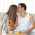 Happy woman kissing her boyfriend for bringing the breakfast stock photo © wavebreak_media
