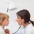Doctor auscultating a child with a stethoscope in examination room stock photo © wavebreak_media