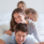 Portrait of a happy family lying on each other in a bedroom stock photo © wavebreak_media