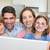 Portrait of a joyful family using a laptop sitting on sofa stock photo © wavebreak_media