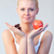 Beautiful woman holding chocolate and apple focus on woman  stock photo © wavebreak_media