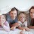 Young family playing together on a bed stock photo © wavebreak_media