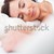A woman lying on the bed with her head on the pillow she is awake and smiling, with her hands on the stock photo © wavebreak_media