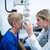 Female optometrist examining young patient on phoropter stock photo © wavebreak_media