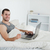 Smiling man purchasing online in his bedroom stock photo © wavebreak_media