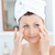 吸引力 · 年輕女子 · 毛巾 · 奶油 · 面對 · 浴室 - 商業照片 © wavebreak_media